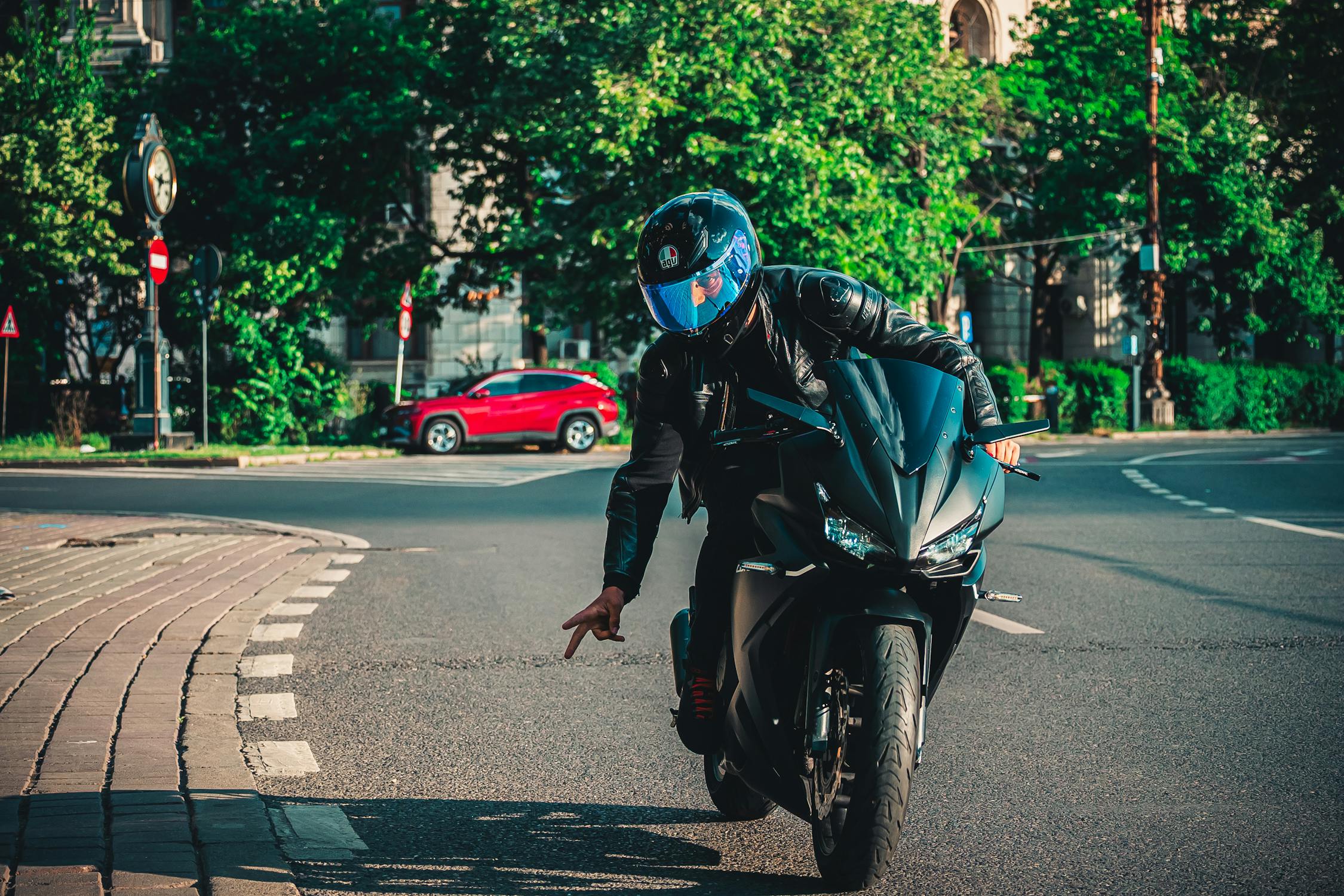 free-photo-of-motorcyclist-performing-trick-on-city-street
